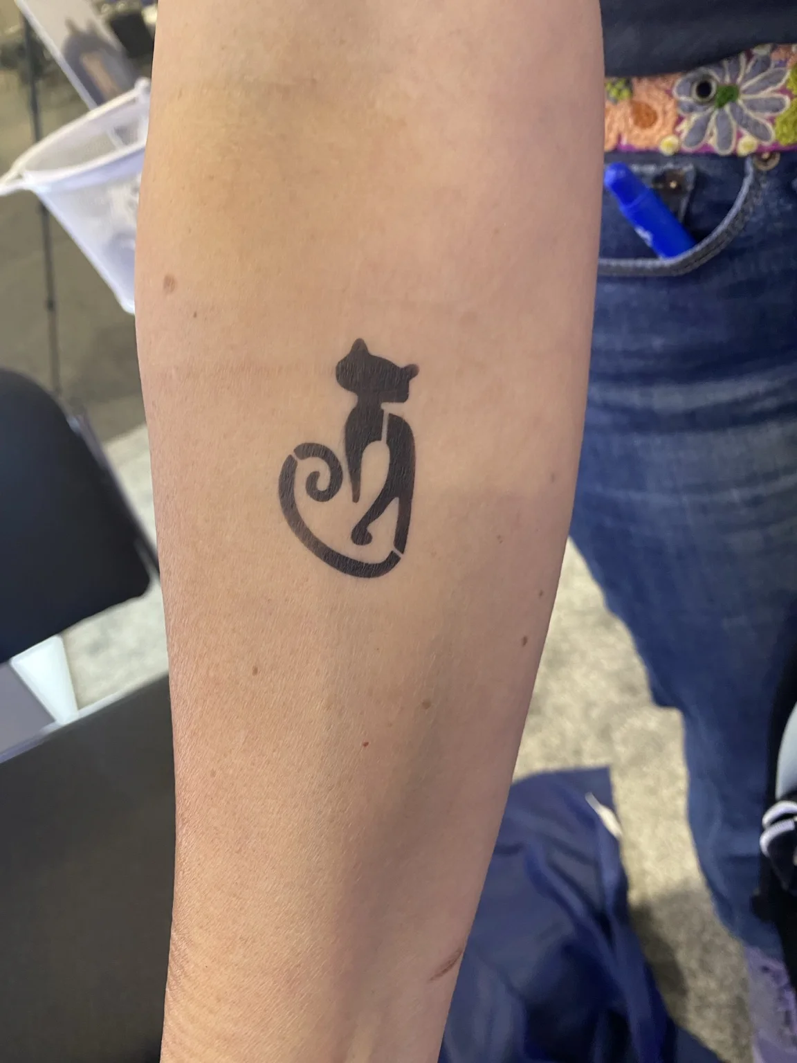Black decorative temporary airbrush tattoo at the Arista corporate event in Savannah, Georgia