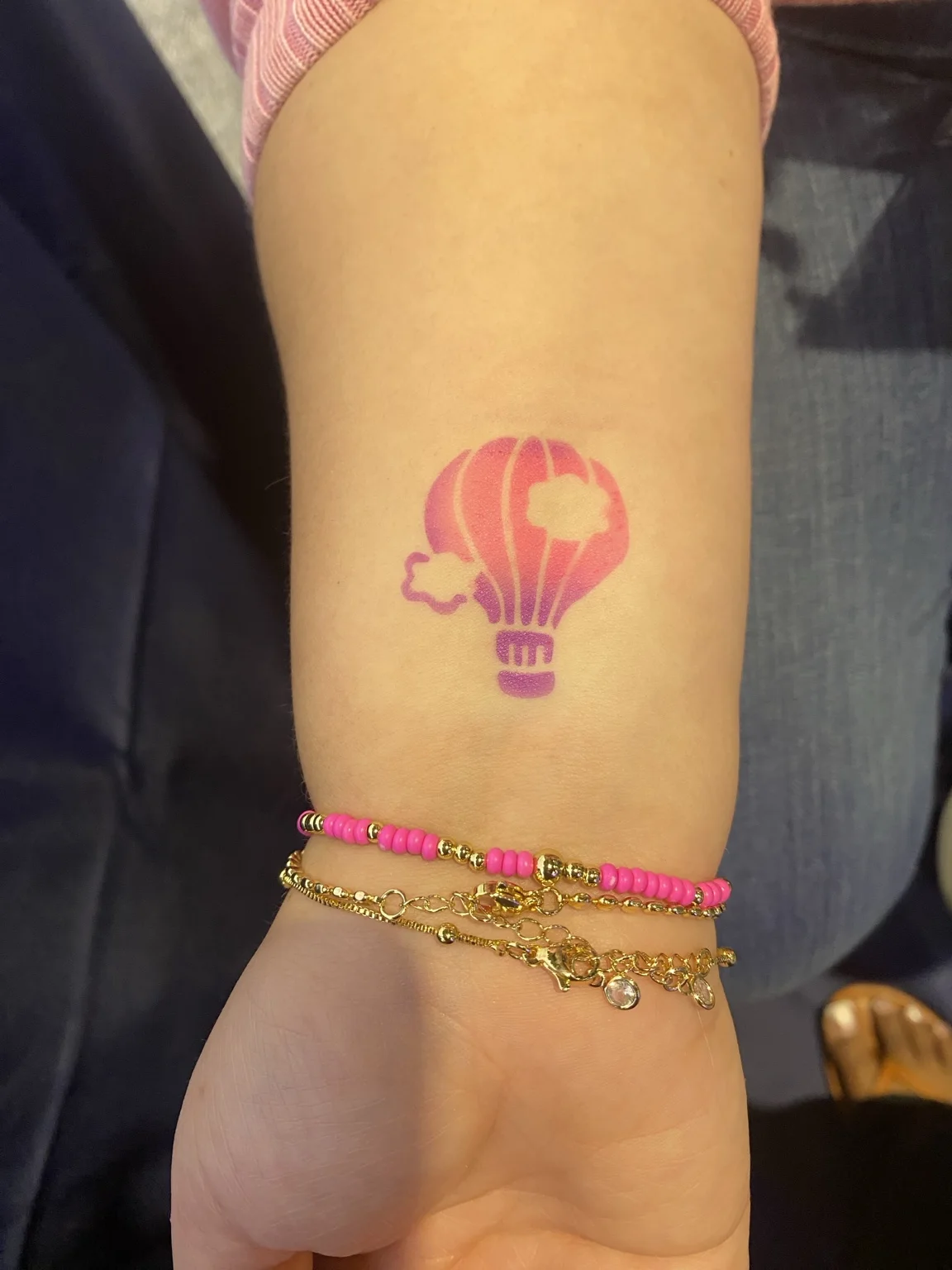 Pink light bulb temporary airbrush tattoo at the Arista corporate event in Savannah, Georgia